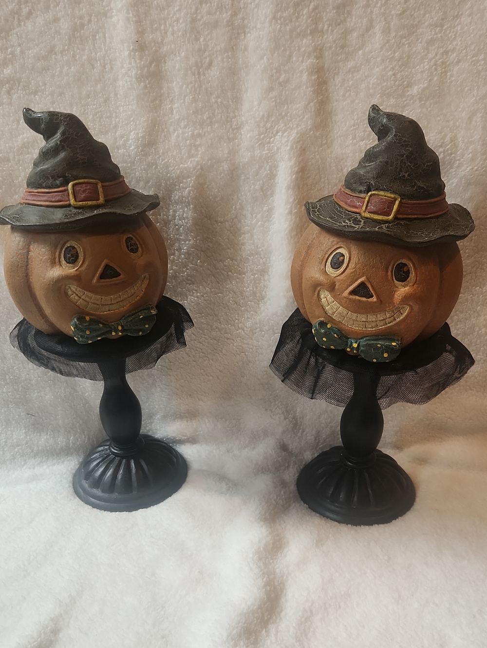 Charming orange pumpkin head figurine with a whimsical witch hat on mantel Set